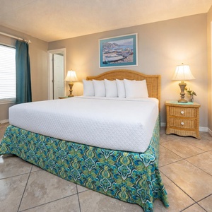 Master bedroom featuring a king bed, stylish decor, and a serene ambiance perfect for relaxation