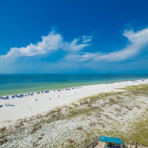 Enjoy breathtaking views of the calm waters and beach from your spacious balcony, perfect for relaxation