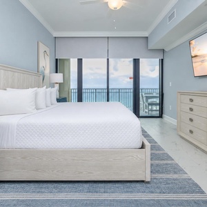 Relax in the master king suite with your favorite shows, elegant decor, and beachfront balcony access