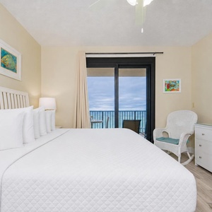 Drift into relaxation in the king master suite, enjoying both the gentle coastal vibe and captivating views