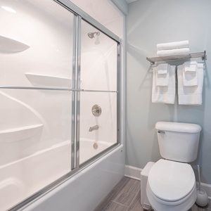 Feel the warm water with a soaking tub or take a refreshing shower in this guest bath