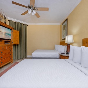 Unwind in the guest suite with two double beds after a day on the water