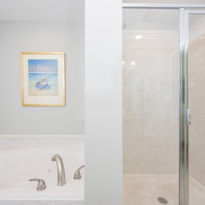 Indulge in relaxation in the master bath with a refreshing walk-in shower and soothing jetted tub