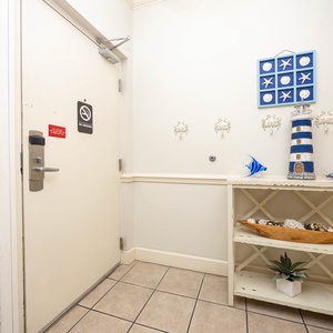 Step into this welcoming entryway, adorned with coastal decor, setting the tone for your relaxing getaway