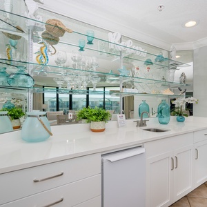 Grab a chilled drink from the fridge or create your favorite cocktail at the wet bar