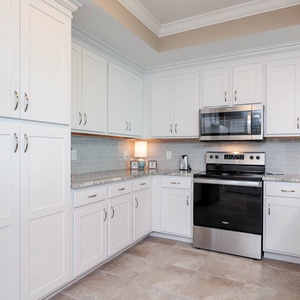 Embrace your culinary creativity in the kitchen, perfect for cooking delicious dishes from your beachside retreat