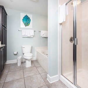 Refresh in the stylish master bath featuring a relaxing jetted tub and spacious walk-in shower