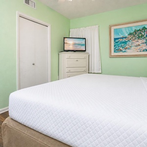 Green walls surround the king suite where you rest on the bed and watch a good movie