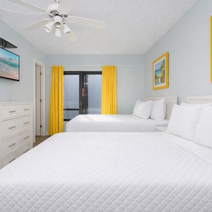 Relax in this inviting guest suite with two double beds, where you can unwind and enjoy your favorite shows