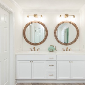 Experience the dual sinks and elegant mirrors in the master bathroom, perfect for refreshing morning routines