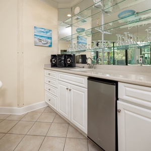 Grab a chilled drink from the fridge or create your favorite cocktail at the wet bar