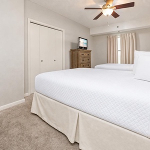Unwind in this guest suite with two double beds and enjoy a good movie after a beach day