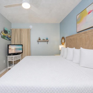 Quiet your mind in the suite's king bed while streaming your favorite show on the compact TV stand nearby
