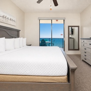 Your king master suite welcomes you with crisp linens and a peaceful coast view from the balcony chairs