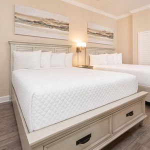 Relax on one of the cozy queen beds in this guest suite and enjoy a peaceful slumber