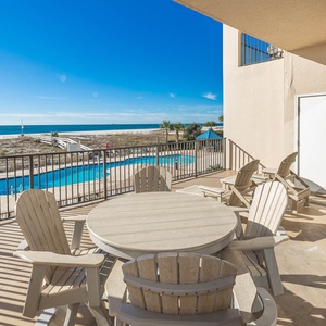 Relax on the extended beachfront balcony, enjoying views of the pool and the beach just steps away