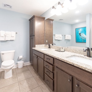 Refresh in the master bath after a day at the beach with a soothing jetted tub and relaxing walk-in shower