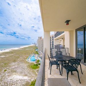 Expansive beach front view showcases tranquil waters and soft white sand, inviting relaxation and seaside strolls