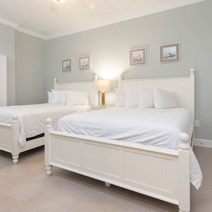 Relax on one of the cozy queen beds in this guest suite and enjoy a peaceful slumber