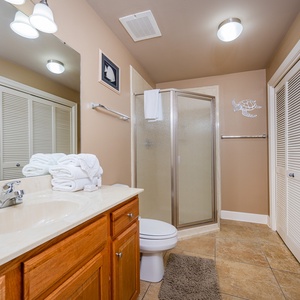 Refresh in this additional guest bath with a walk-in shower and laundry area with a washer and dryer in your rental