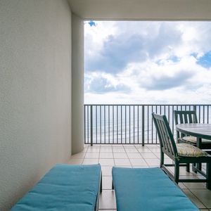 Relax on the cozy loungers while enjoying breathtaking views from the spacious balcony