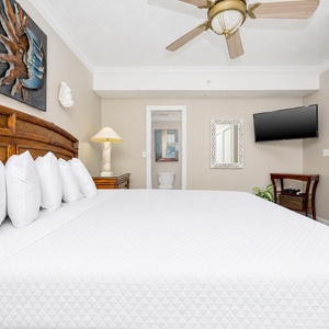Experience comfort in this bedroom, featuring a king bed, decorative accents, and a relaxing atmosphere