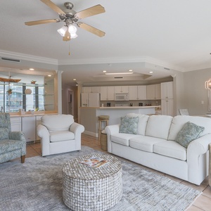 Relax on plush seating, enjoying laughter and comfort in this spacious living area