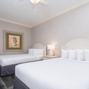 Relax on one of the cozy queen beds in this guest suite and enjoy a peaceful slumber