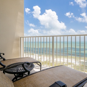 Enjoy breathtaking views from the balcony, featuring comfortable seating and a table for relaxing moments outdoors