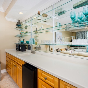 Grab a chilled drink from the fridge or create your favorite cocktail at the wet bar