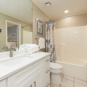 Soft scents of coastal breeze mix with floral soap as you refresh in the bathroom during your stay
