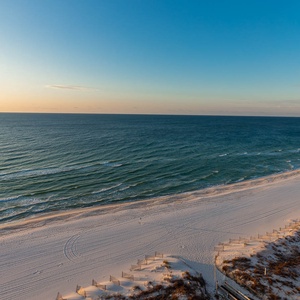 Gaze at the serene waters and soft shoreline, perfect for morning sunrise strolls or evening sunsets