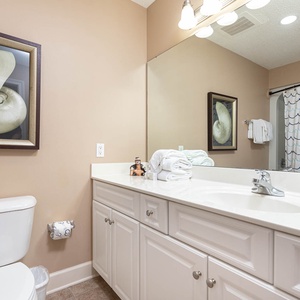 Rejuvenate in the guest bath, where fluffy towels await after an invigorating soak in the inviting tub