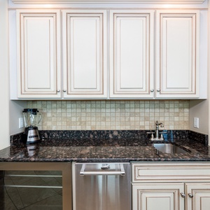 Prepare refreshing drinks or snacks at the stylish wet bar, enjoying quality connections with family