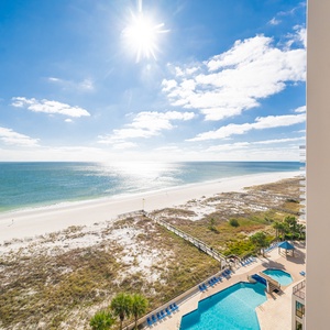 Bask in the sun on the balcony, enjoying sweeping views of the tranquil waters and the inviting pool below