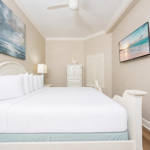Find comfort as you unwind in this king guest suite, watching your favorite shows on the TV after a beach day