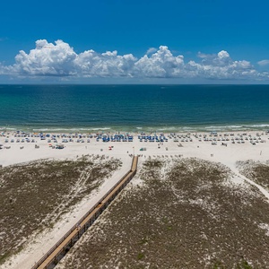 Relax on your balcony and bask in the sunlight with mesmerizing views of the gulf coast on your beach retreat