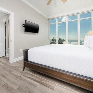 Awake refreshed in a king bed in this guest suite and enjoy spectacular coast views from expansive windows