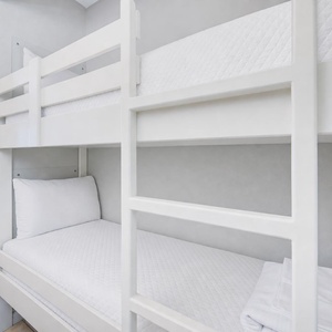 Bunk beds in the hallway offer a cozy spot for the kids after fun-filled days along the coast