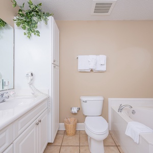Indulge in a soothing soak in the jetted tub, surrounded by fresh towels and a tranquil ambiance