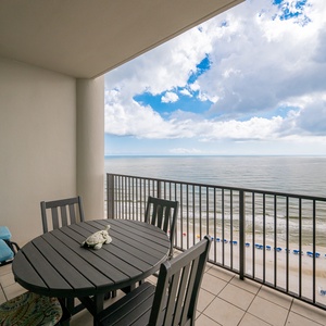 Enjoy a meal from the balcony with a dining table, perfect for relaxing by the water's edge