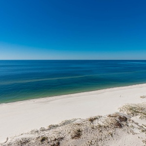 Breathtaking views of the shoreline and gentle waves from your beachfront balcony