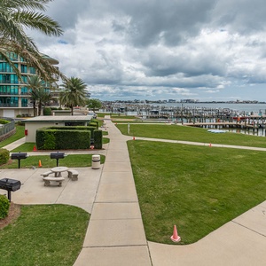 Stroll along the landscaped paths, enjoying the refreshing breeze and beautiful views of the marina and coast