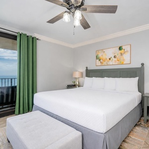 Drift into restful sleep in this serene king master suite, with captivating coastal views from your balcony