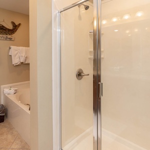 Indulge in relaxation in the master bath with a refreshing walk-in shower and soothing jetted tub