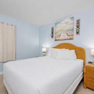 Drift into relaxation in the queen guest suite, embraced by a soothing vibe and beach decor that invites restful sleep