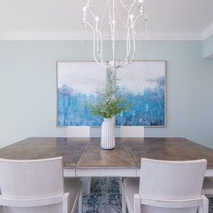 Savor peaceful moments gathered around the elegant dining table, embraced by coastal tranquility and stunning views