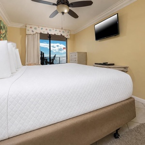 Enjoy restful nights in the master bedroom featuring a king bed and beachfront balcony access
