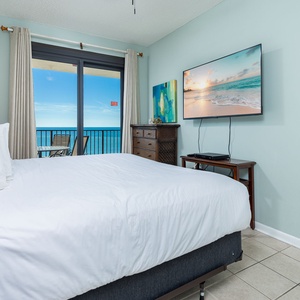 Enjoy the sounds of the waves in this inviting master bedroom with a king bed and beachfront balcony access