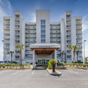Welcome to Ocean House in Gulf Shores, where palm trees frame a welcoming entrance just steps from the beautiful beachfront